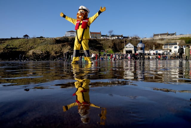 The RNLI mascot on the beach at the Loony Dook New Year's Day dip in the Firth of Forth at Kinghorn in Fife.