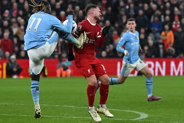 Liverpool wanted a penalty for this challenge by Man City's Jeremy Doku on Alexis Mac Allister.