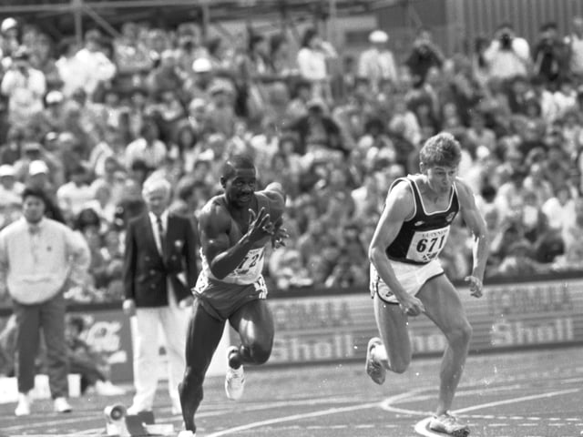 Canada's Ben Johnson leading Scotland's Jamie Henderson in the men's 100m sprint, at the 1986 Edinburgh Commonwealth Games.