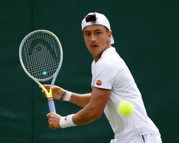 Ryan Peniston of Great Britain playing against Steve Johnson during the second round of men's singles at Wimbledon 2022 (Photo by Clive Brunskill/Getty Images)
