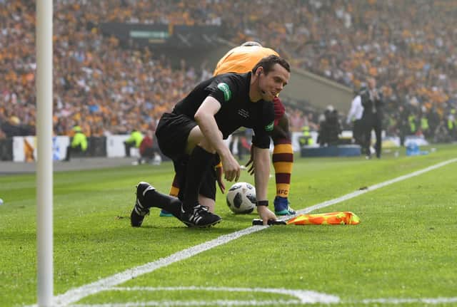 Linesman Douglas Ross takes a tumble