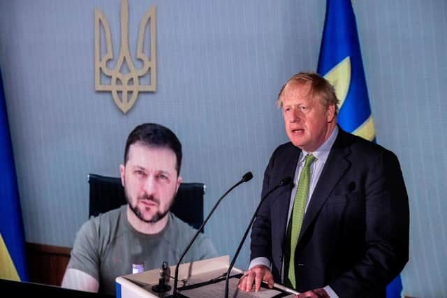 Prime Minister Boris Johnson in front of a live video feed showing Ukrainian President Volodymyr Zelenskyy at the Tate Modern in London last month.