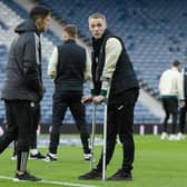 Jake Doyle-Hayes, pictured on crutches recently at Hampden, has already missed several months of the season.