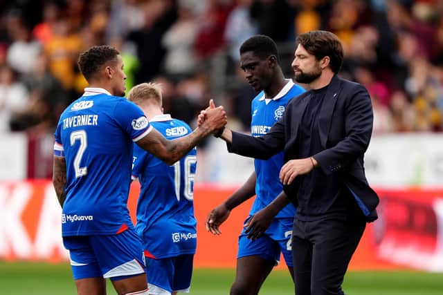 Rangers manager Russell Martin (right) and James Tavernier (left) shake hands at the final whistle after the William Hill Premiership match at Fir Park, Motherwell. (Photo by Andrew Milligan/PA Wire)