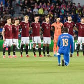 Sparta Prague's players stand while Rangers midfielder Glen Kamara anddefender Borna Barisic take the knee prior to the start of the UEFA Europa League Group A football match between AC Sparta Praha and Rangers FC (Photo by MICHAL CIZEK/AFP via Getty Images)