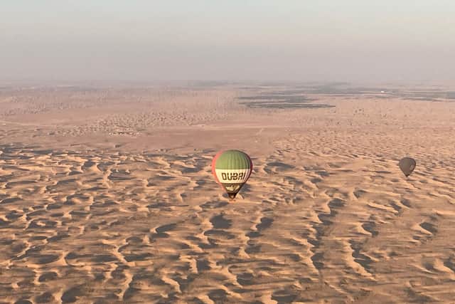 A hot air balloon over the Arabian Desert. Pic: Hannah Stephenson/PA.