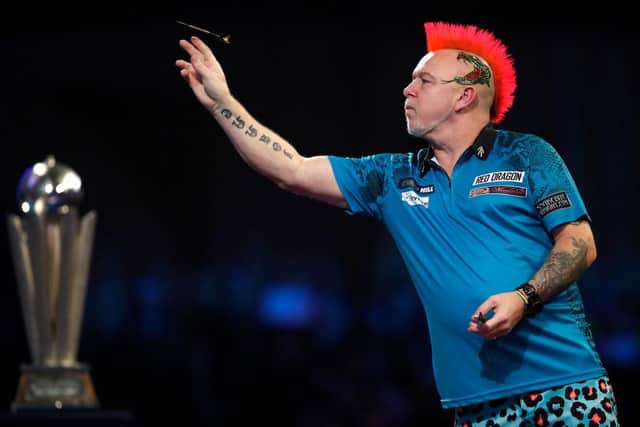 Peter Wright in action against Michael Smith at Alexandra Palace on January 03, 2022 in London, England. (Photo by Luke Walker/Getty Images)