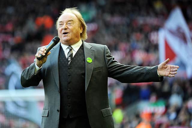 Marsden performing 'You'll Never Walk Alone' before a Liverpool vs. Blackburn Rovers match at Anfield in 2010 (Photo: John Powell/Liverpool FC via Getty Images)
