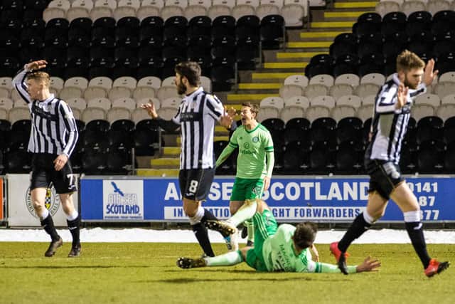 Greg Taylor hits the deck after tangling with Ryan Flynn for a penalty award that has led Jim Goodwin to claim the player went to ground too easily - to the chagrin of Neil Lennon. (Photo by Craig Williamson / SNS Group)