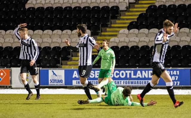 Greg Taylor hits the deck after tangling with Ryan Flynn for a penalty award that has led Jim Goodwin to claim the player went to ground too easily - to the chagrin of Neil Lennon. (Photo by Craig Williamson / SNS Group)