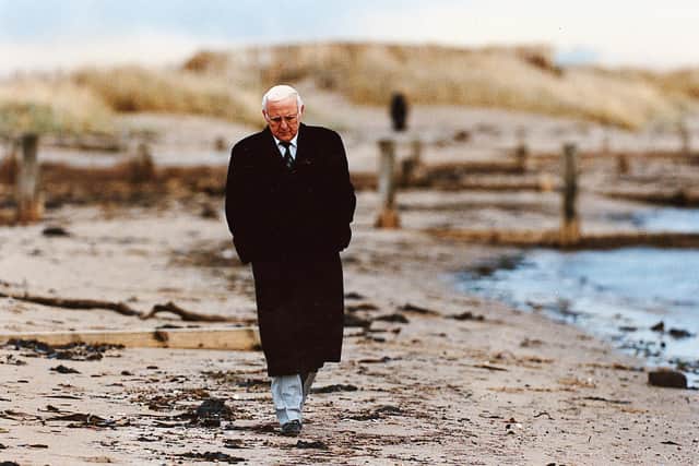 Jim McLean takes a walk along the beachfront at Broughty Ferry in 1995.