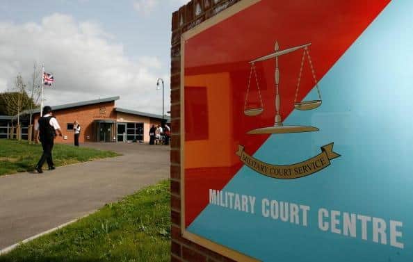 A policeman makes his way to the Bulford Military Court Centre at the Kiwi Barracks in Salisbury. Picture: Daniel Berehulak/Getty Images