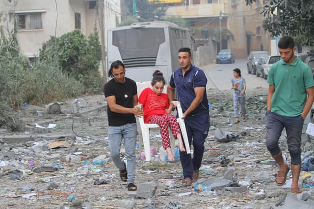 Palestinians evacuate their homes in Gaza City after Israeli airstrikes in October (Picture: Ahmad Hasaballah/Getty Images)