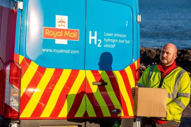 Postal worker Mark Humphrey with the new hydrogen van. Picture: Royal Mail/Katielee Arrowsmith/SWNS