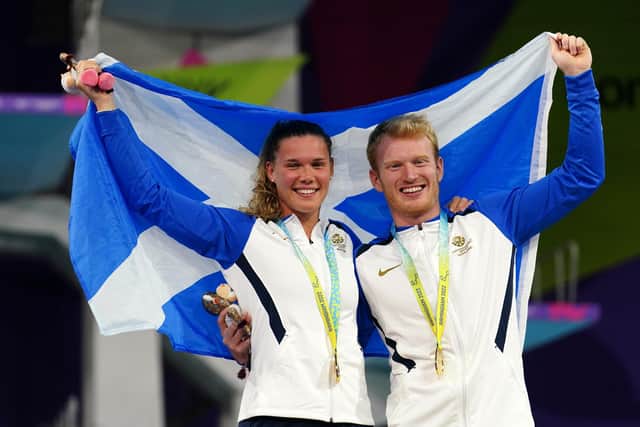 Scotland's James Heatly and Grace Reid with their gold medals won in the Mixed Synchronised 3m Springboard Final at Sandwell Aquatics Centre on day eleven of the 2022 Commonwealth Games in Birmingham.