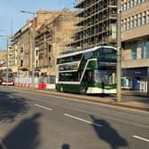 Buses run along Princes Street in Edinburgh as it reopens following a fire at the old Debenhams store building in early July (Picture: Neil Pooran/PA Wire)