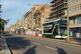 Buses run along Princes Street in Edinburgh as it reopens following a fire at the old Debenhams store building in early July (Picture: Neil Pooran/PA Wire)