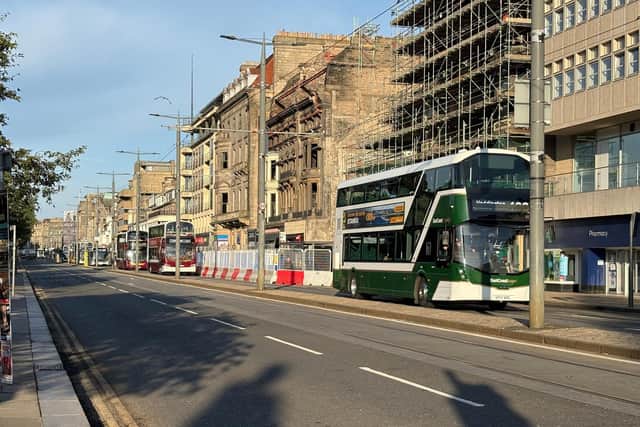 Buses run along Princes Street in Edinburgh as it reopens following a fire at the old Debenhams store building in early July (Picture: Neil Pooran/PA Wire)