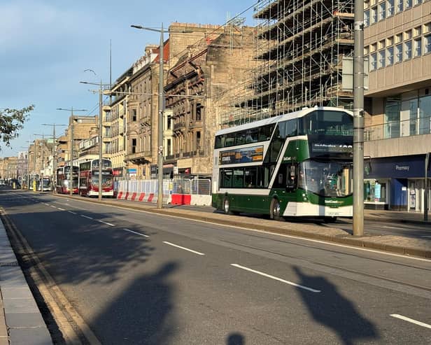 Buses run along Princes Street in Edinburgh as it reopens following a fire at the old Debenhams store building in early July (Picture: Neil Pooran/PA Wire)