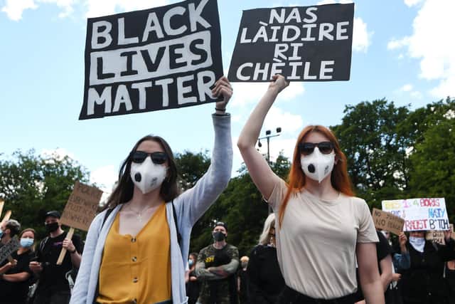 Anti-racism protesters gather at a Black Lives Matter rally.