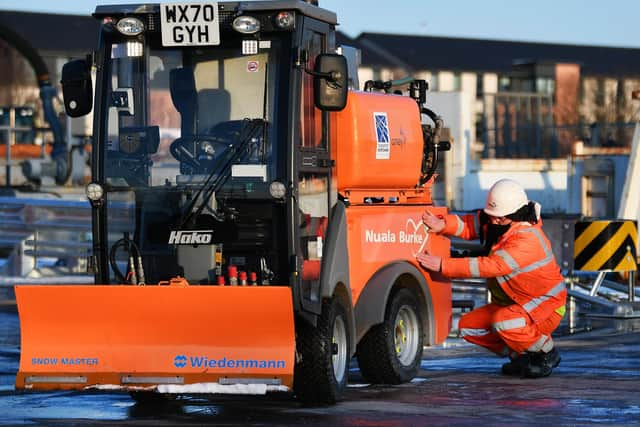 Nuala Burke's name is added to one of road firm Amey's mini gritters. Picture: John Devlin