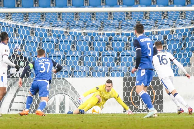 Jon McLaughlin makes a rare save against Lech Poznan in Poland