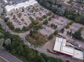 Cars queue for fuel at a Sainsbury's petrol station in Camberley, Surrey.