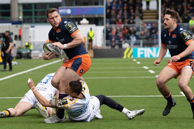 Mark Bennett tries to find a way through for Edinburgh against Wasps. (Photo by Ross Parker / SNS Group)