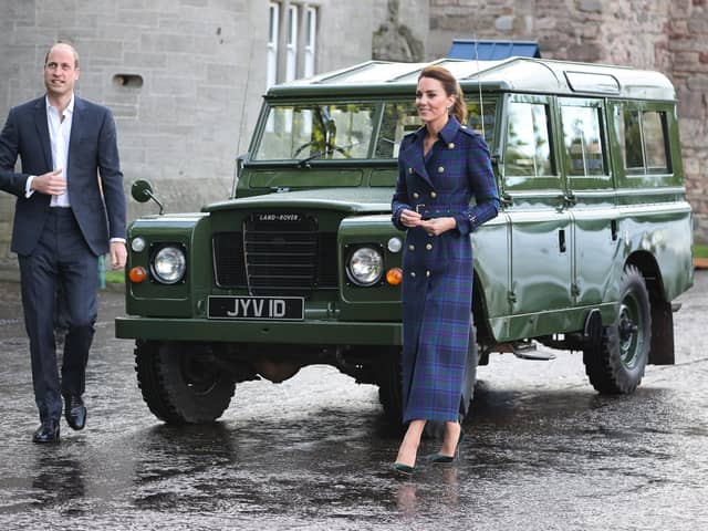 The Duke and Duchess of Cambridge arrive, in a Land Rover that previously belonged to the Duke of Edinburgh