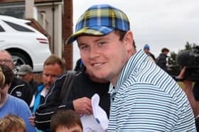 Bob MacIntyre autographs for young fans during the Genesis Scottish Open Pro-Am at The Renaissance Club. Picture: Andrew Redington/Getty Images.