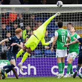 Ross County's Simon Murray (L) hits the bar during the 2-1 win over Hibs at the Global Energy Stadium. (Photo by Ross Parker / SNS Group)