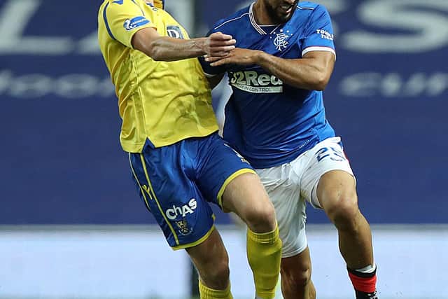 Ali McCann of St Johnstone battles for possession with Kemar Roofe of Rangers FC during the Ladbrokes Scottish Premiership match between Rangers and St. Johnstone at Ibrox Stadium on August 12, 2020 in Glasgow, Scotland. (Photo by Ian MacNicol/Getty Images)