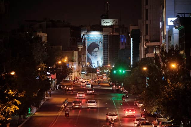 A giant banner depicting Iran's Supreme Leader Ayatollah Ali Khamenei in downtown Tehran (Picture: Morteza Nikoubazl/AFP via Getty Images)