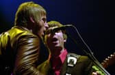 Paul Weller (left) and Noel Gallagher, seen performing in 2001, could still reform their respective bands, judging by the track record of other rock and roll stars (Picture: William Conran/PA)