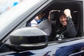 Rangers manager Steven Gerrard raises a fist in celebration at the club's Auchenhowie training base after the title was confirmed. (Photo by Ross MacDonald / SNS Group)