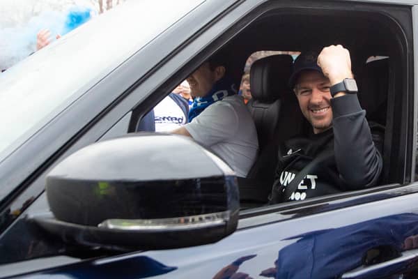 Rangers manager Steven Gerrard raises a fist in celebration at the club's Auchenhowie training base after the title was confirmed. (Photo by Ross MacDonald / SNS Group)