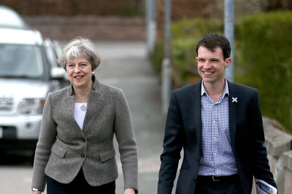 Andrew Bowie (right) walks the campaign trail with former prime minister Theresa May in Aberdeenshire. Picture: Jane Barlow/PA Wire