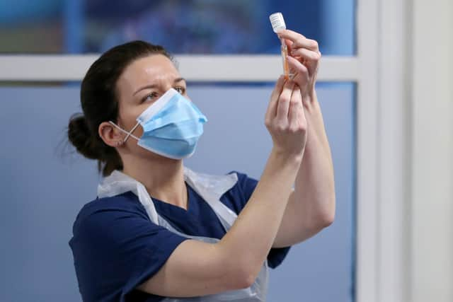 A nurse fills a syringe with a dose of AstraZeneca Covid vaccine (Picture: Russell Cheyne/WPA pool/Getty Images)