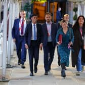 Prime Minister Rishi Sunak (left) arrives at the Conservative Party annual conference at Manchester Central convention complex.