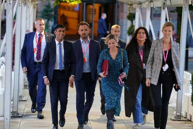 Prime Minister Rishi Sunak (left) arrives at the Conservative Party annual conference at Manchester Central convention complex.