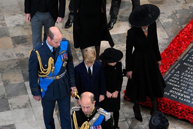 William, Prince of Wales, Prince George of Wales, Princess Charlotte of Wales and Catherine, Princess of Wales departing Westminster Abbey during the State Funeral of Queen Elizabeth II.