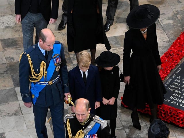 William, Prince of Wales, Prince George of Wales, Princess Charlotte of Wales and Catherine, Princess of Wales departing Westminster Abbey during the State Funeral of Queen Elizabeth II.