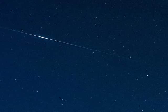 The satellites appear in a line crossing the night sky and their current orbital position has made them easier to spot (Photo: Shutterstock)