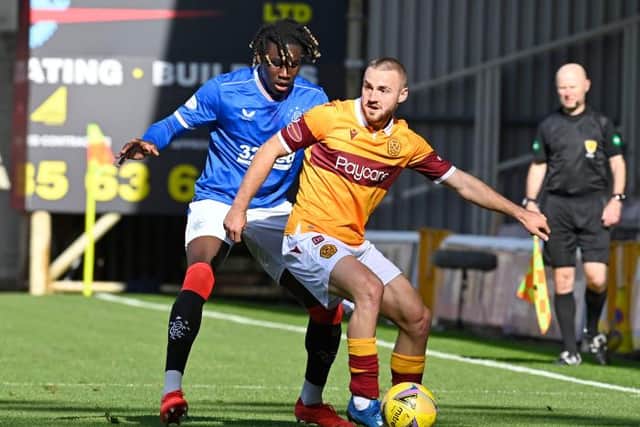 Calvin Bassey tussles with Motherwell's Allan Campbell during Sunday's game (Photo by Rob Casey / SNS Group)
