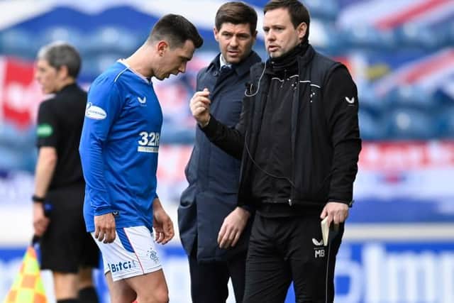 Rangers' Ryan Jack leaves the field as manager Steven Gerrard watches on during a Scottish Premiership match between Rangers and Dundee United at Ibrox on February 21, 2021, in Glasgow, Scotland (Photo by Rob Casey / SNS Group)