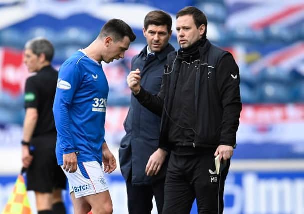 Rangers' Ryan Jack leaves the field as manager Steven Gerrard watches on during a Scottish Premiership match between Rangers and Dundee United at Ibrox on February 21, 2021, in Glasgow, Scotland (Photo by Rob Casey / SNS Group)
