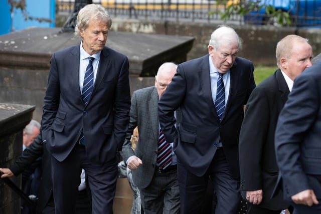 Former chairman Alastair Johnston (L) and club legend John Greig arrive at the funeral of Rangers kitman Jimmy Bell