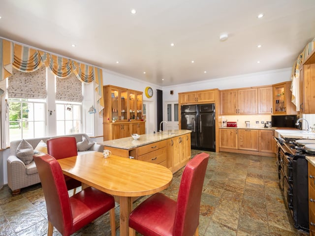 The contemporary kitchen with an Aga range oven.