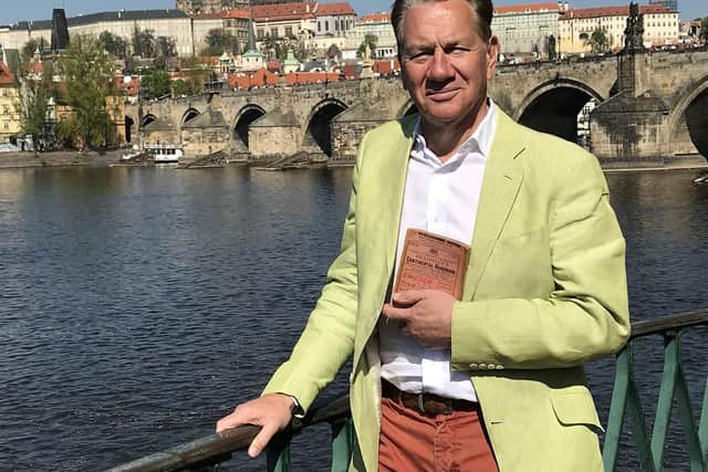 Programme Name: Great Continental Railway Journeys S7 - TX: n/a - Episode: n/a (No. 5) - Picture Shows: by Charles Bridge, Prague Michael Portillo - (C) Boundless, part of FremantleMedia UK - Photographer: Production