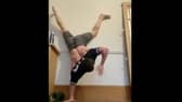 Tom Holland attempting to get a t-shirt on whilst doing a handstand (Photo: Tom Holland)